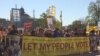 Hundreds of protesters rally against big money in politics during a march in Washington, D.C., April 18, 2016. (E. Sarai/VOA)