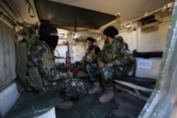 Turkish-backed rebel fighters prepare for an attack near the village of Neirab in Idlib province, Syria, Feb. 20, 2020. Two Turkish soldiers were killed Thursday by an airstrike in northwestern Syria, according to Turkey's Defense Ministry.
