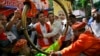 Supporters of India’s ruling Bharatiya Janata Party (BJP) celebrate as early results indicated the party leading in the Maharashtra state Assembly elections in Mumbai, India, Oct. 19, 2014. 
