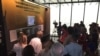 Visitors and media take in an exhibit at the new Flight 93 National Memorial Visitors Center in Shanksville, Pennsylvania, September 10, 2015. (K. Farabaugh/VOA)