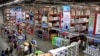 FILE - Indian people shop at a Bharti-Walmart store on the outskirts of Chandigarh, India.