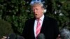 President Donald Trump speaks to reporters before leaving the White House, Nov. 21, 2017, in Washington, for a Thanksgiving trip to Mar-a-Lago estate in Palm Beach, Fla. Trump all but endorsed embattled Alabama Republican Senate candidate Roy Moore.