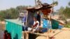 FILE PHOTO: Amir Ali, 75, plays a violin in front of his house in Kutuapalong Rohigya refugee camp in Cox's Bazar, Bangladesh, Feb. 8, 2019.