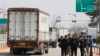 South Korean vehicles turn back after they were refused for entry to North Korea's city of Kaesong, at the customs, immigration and quarantine office in Paju, South Korea, near the border village of Panmunjom, April 3, 2013.