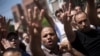 Supporters of Egypt's ousted President Mohammed Morsi chant slogans against the Egyptian Army during a march near Al Nour mosque in Abassia district in Cairo, Egypt, Aug. 23, 2013. 