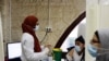 An Arab medical worker prepares to vaccinate a man against the coronavirus disease (COVID-19) as Israel continues its national vaccination campaign amid a third COVID-19 lockdown, in East Jerusalem, Jan. 7, 2021.