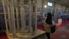 FILE - A student looks at Iran's domestically built centrifuges in an exhibition of the country's nuclear achievements, in Tehran, Iran, Feb. 8, 2023. Iran has increased its supply of uranium that has been enriched to 60% purity, according to IAEA reports seen by news agencies.  