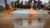FILE - A closed ballot box waits to be taken to an electoral commission after voting in Buwuno, Uganda, on Feb. 18, 2011. 