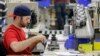 FILE - Anthony Zingale wires blender motors at the Vitamix manufacturing facility in Strongsville, Ohio. Some fear manufacturing jobs will be put at risk by the TPP deal.