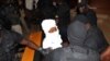 FILE - Security personnel surround former Chadian dictator Hissene Habre inside a courtroom in Dakar, Senegal, July 20, 2015.