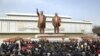 North Koreans place flowers before the statues of North Korean founder Kim Il-sung (L) and his son, late leader Kim Jong-il, on the 101st anniversary of the elder Kim's birth in Pyongyang, April 15, 2013. (KCNA)