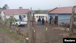 Police officials work at the scene of a mass shooting in Lusikisiki, South Africa, on Sept. 28, 2024. (South African Police Services via Reuters)