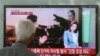 South Korean man watches a TV news program reporting missile launch conducted by North Korea in Seoul May 20, 2013.