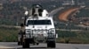 Spanish U.N. peacekeepers patrol the Lebanese Israeli border in the southern village of Odaisa, Lebanon, Aug. 29, 2013. 