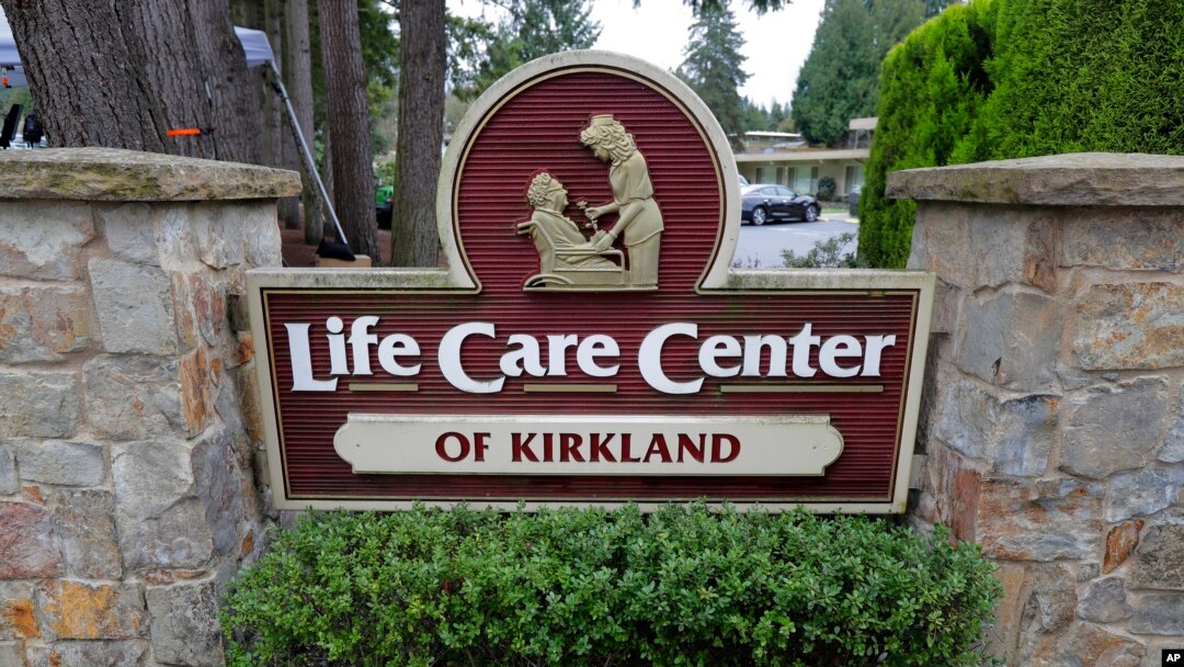 A sign at the entrance of the Life Care Center is shown in Kirkland, Wash., near Seattle, Tuesday, March 3, 2020. Dozens of people associated with the facility are reportedly ill with respiratory symptoms or hospitalized and are being tested for the…