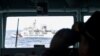 Kapal Penjaga Laut China terlihat dari kapal Angkatan Laut Indonesia saat berpatroli di laut Zona Ekonomi Eksklusif Indonesia di utara pulau Natuna, Indonesia, 11 Januari 2020. (Foto. Antara Foto/M Risyal Hidayat/via REUTERS)