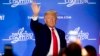 President Donald Trump waves after speaking at the Latino Coalition Legislative Summit, March 4, 2020, in Washington.