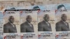 FILE - Election posters for opposition candidate Ayah Paul Abine of the People Action Party are pasted on a wall in the capital Yaounde, Cameroon, Oct. 7, 2011. 