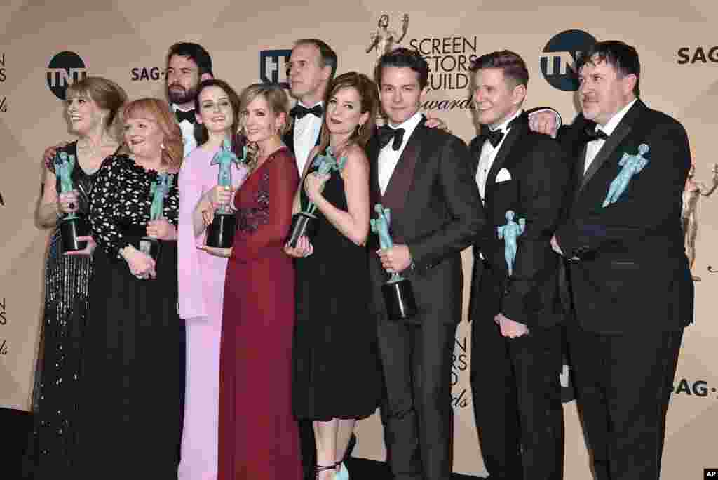 The cast of Downton Abbey pose in the press room with their awards for outstanding ensemble in a drama series at the 22nd annual Screen Actors Guild Awards at the Shrine Auditorium &amp; Expo Hall in Los Angeles, Jan. 30, 2016.