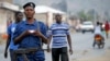 Burundi police patrol the streets of Musaga district in the capital Bujumbura after the results of the presidential elections were released, July 24, 2015.