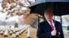 President Donald Trump speaks to media he visits Section 60 at Arlington National Cemetery in Arlington, Va., Dec. 15, 2018.