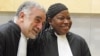 International Criminal Court (ICC) prosecutor Fatou Bensouda shares a laugh with her predecessor Luis Moreno-Ocampo (L) at the ICC, The Hague, June 15, 2012. 