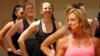 Women participate in a fitness class lead by Kira Stokes, right, at NYSC Lab in New York, May 11, 2017.