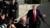 FILE - President Donald Trump speaks to reporters on the South Lawn of the White House, in Washington, Nov. 29, 2018.