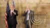 FILE - Israeli Prime Minister Benjamin Netanyahu (L) and U.S. Ambassador to Israel David M. Friedman light the first Hanukkah at the Western Wall in Jerusalem's Old City during the the Jewish holiday of Hanukkah, Dec. 10, 2020.