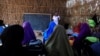 Zeinab's English teacher Abdiweli Mohammed Hersi teaches children at the school near a camp for internally displaced people from drought hit areas in Dollow, Somalia, April 3, 2017. 