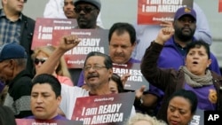 FILE - Community activists rally during an event on Deferred Action for Childhood Arrivals (DACA) and Deferred Action for Parental Accountability (DAPA) in downtown Los Angeles, California, Feb. 17, 2015. 