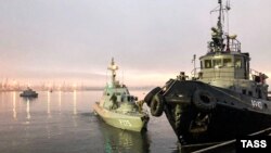 UKRAINE - Three ships of the Naval Forces of Ukraine artillery boats "Nikopol", "Berdyansk" and raid tug "Yani Kapu" (from left to right), towed to the city port, on November 26, 2018.
