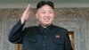 North Korean leader Kim Jong Un watches a military parade held to celebrate the centenary of the birth of the North's founder Kim Il Sung, in Pyongyang on April 15, 