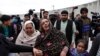 An Afghan Sikh woman mourns for her relatives near the site of an attack in Kabul, Afghanistan March 25, 2020.