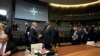 U.S. Defense Secretary Lloyd Austin, center-right, speaks with Dutch Defense Minister Henk Kamp, center-left, ahead of a meeting of NATO defense ministers at NATO headquarters in Brussels, Oct. 21, 2021.