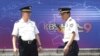 South Korean police officers stand guard in front of the Korea Broadcasting System (KBS) building in Seoul, South Korea, June 4, 2012. 