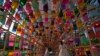 FILE - Visitors wearing face masks to help curb the spread of the coronavirus walk through the lanterns at the Royal Culture Festival at the Gyeongbok Palace, one of South Korea's well-known landmarks, in Seoul, South Korea, Tuesday, Oct. 19, 2021. 