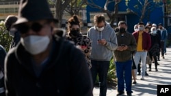 People wait in line for a COVID-19 test in Los Angeles, California, Jan. 4, 2022.
