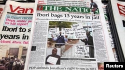 FILE - Newspapers, with details of the sentencing of James Ibori, are seen on a a news-stand in Lagos. A British court sentenced Ibori, the former governor of a Nigerian oil state, to 13 years in prison after he pleaded guilty to embezzling 50 million pounds ($79 million) in one of the biggest money-laundering cases seen in Britain.