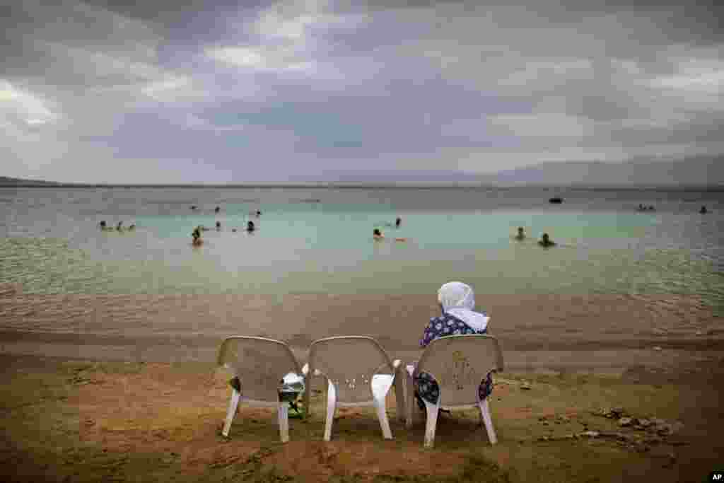 Tourists float in the Dead Sea, Israel.