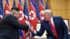 FILE - In this June 30, 2019, file photo, U.S. President Donald Trump, right, meets with North Korean leader Kim Jong Un at the border village of Panmunjom in the Demilitarized Zone, South Korea.