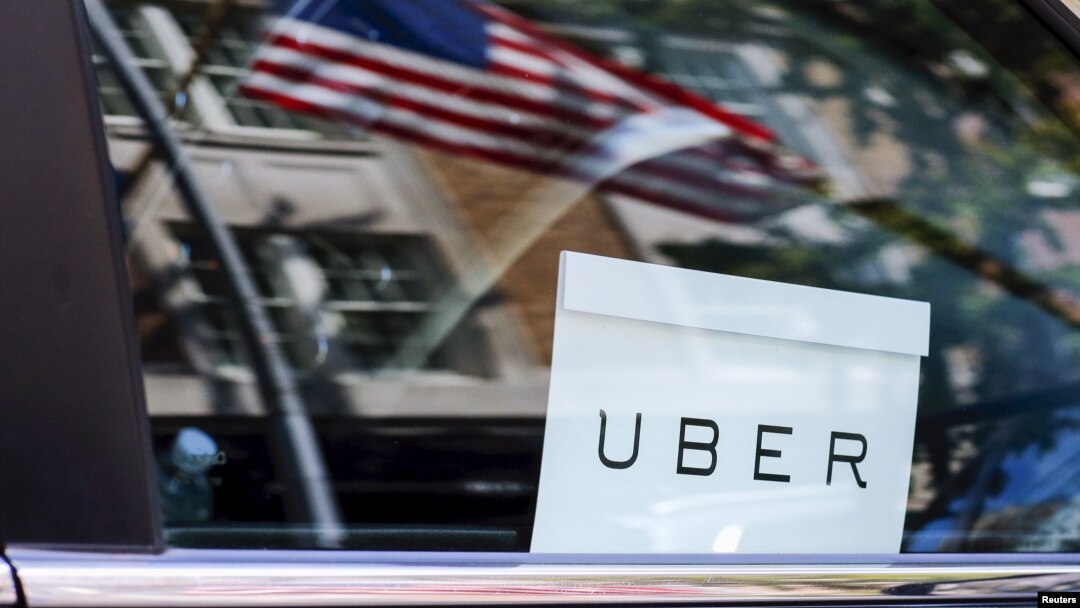 An Uber sign is seen in a car in New York. 