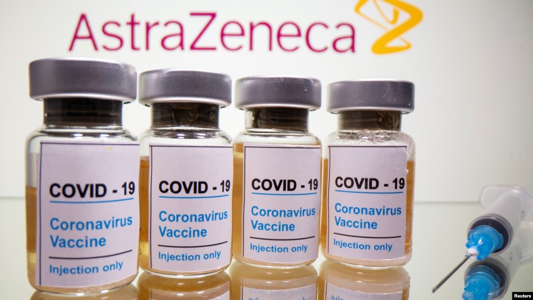 FILE - Vials with a sticker reading, "COVID-19" are seen in front of a displayed AstraZeneca logo in this illustration taken October 31, 2020. (REUTERS/Dado Ruvic/Illustration/File Photo)