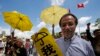 FILE - Pro-democracy protesters holding yellow umbrellas attend a rally outside the Legislative Council in Hong Kong, Wednesday, June 17, 2015.