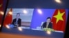 A TV screen shows Vietnamese Foreign Minister Pham Binh Minh and his Chinese counterpart Wang Yi during a virtual meeting on bilateral issues, in Hanoi, Vietnam, July 21, 2020.