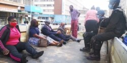 Zimbabwe police arresting members of the opposition for violating the country's lockdown regulations in July 2020 when they took part in protests against the government’s response to the pandemic. (Columbus Mavhunga/VOA)
