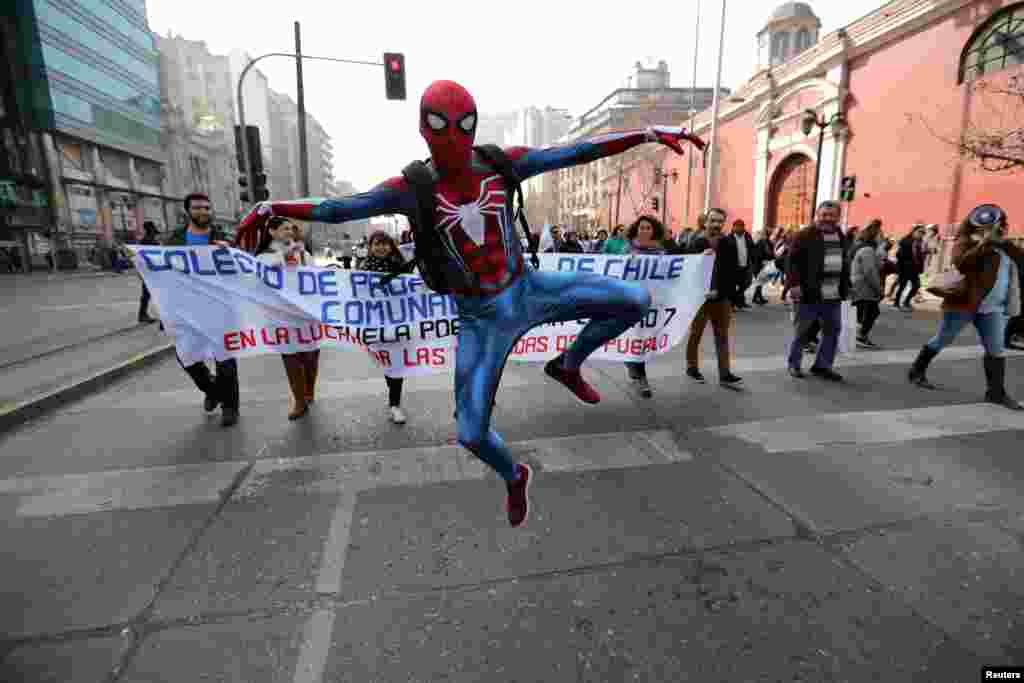 A demonstrator wearing a Spider-Man costume attends a teachers' march during a national strike demanding better working conditions in Santiago, Chile.