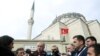 FILE - Turkish President Recep Tayyip Erdogan talks to journalists in Istanbul, Turkey, Feb. 21, 2020.