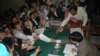 Pakistan's former prime minister Nawaz Sharif (C) submits his nomination papers for the upcoming by-elections in Lahore May 13, 2008. Pakistani prime minister Yousuf Raza Gilani called for a last-ditch effort to save his government on Tuesday, after refus