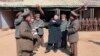 North Korean leader Kim Jong-Un (C) visits a long-range artillery sub-unit of the Korean People's Army Unit 641, March 11, 2013 in this picture released by the North's official KCNA news agency in Pyongyang, March 12, 2013. 